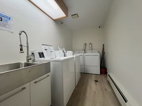 Regina apartment for rent - A laundry room with a washer and dryer.