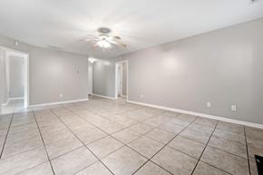 Jacksonville house for rent - the living room and dining room in a new home with tile flooring