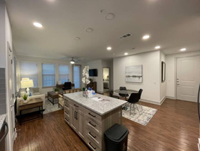 Plano house for rent - a living room with a kitchen and a dining room