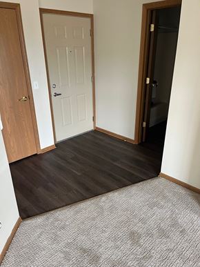 Round Lake Beach apartment for rent - the doorway to a room with wood flooring and a white door