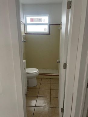 Fort Myers apartment for rent - A bathroom with a toilet and a window.