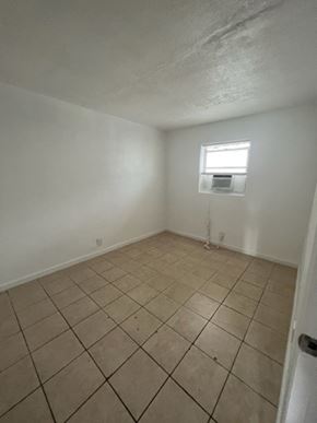 Fort Myers apartment for rent - A room with a window and tiled floor.