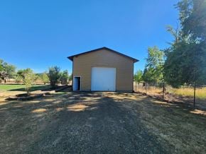 Dallas house for rent - a garage with a white door on the side of a building
