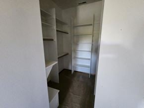 Dallas house for rent - a walk in closet with shelves and empty shelves