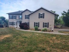 Dallas house for rent - a white house with a yard and a driveway