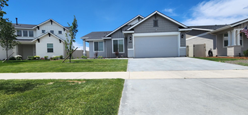 Meridian house for rent - a house with a driveway and lawn in front of it