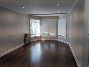 Evanston apartment for rent - a living room with wood floors and a large window