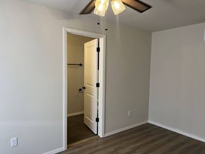 Shawnee house for rent - A room with a door and a ceiling fan.