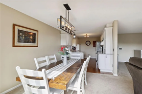Hudson house for rent - a dining room with a wooden table and chairs