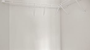 Fayetteville house for rent - an empty closet with white rods on the ceiling