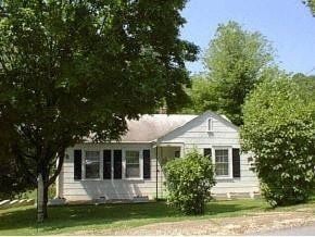 Kingsport house for rent - a white house with a tree in front of it