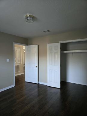 Hattiesburg apartment for rent - A room with a white door and a white closet.