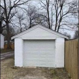 Louisville apartment for rent - a small garage in front of some trees