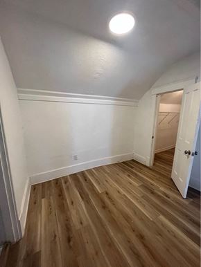 Louisville apartment for rent - a living room with wooden floors and white walls