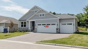 Hudson house for rent - a white house with a driveway and a garage door
