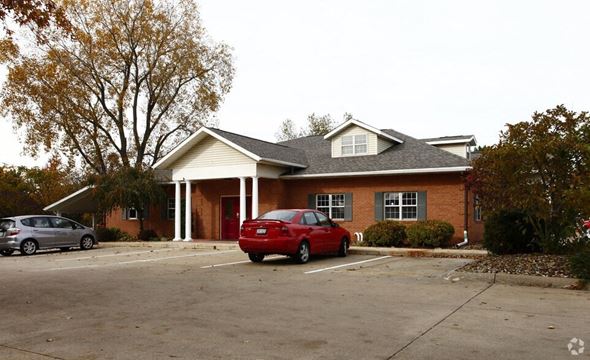 Medina apartment for rent - A red car is parked in front of a house.