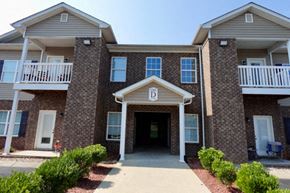 Bowling Green apartment for rent - A building with a front entrance and a balcony.