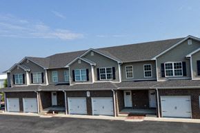 Bowling Green apartment for rent - A row of houses with garages in front.