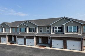Bowling Green apartment for rent - A row of houses with garages in front.