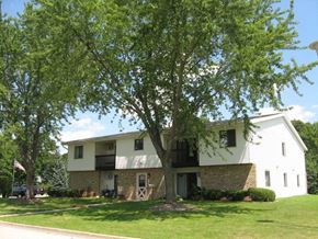 Mayville apartment for rent - a white house with a large tree in front of it