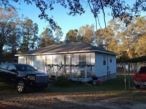 Warrenville house for rent - A house with a car parked in front of it.