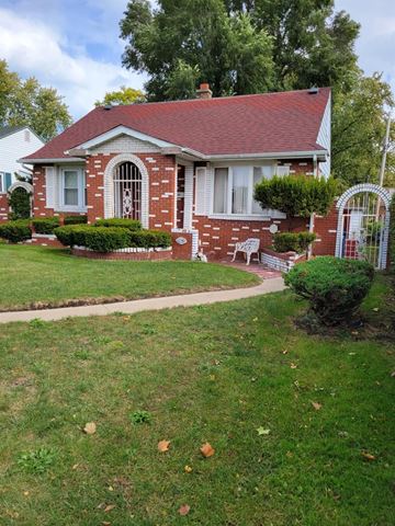 Gary house for rent - a small brick house with a lawn in front of it