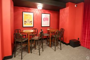 Richmond apartment for rent - a dining room with red walls and tables and chairs