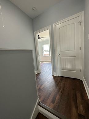 Crowley apartment for rent - a hallway with a white door and a door to a room with a door open