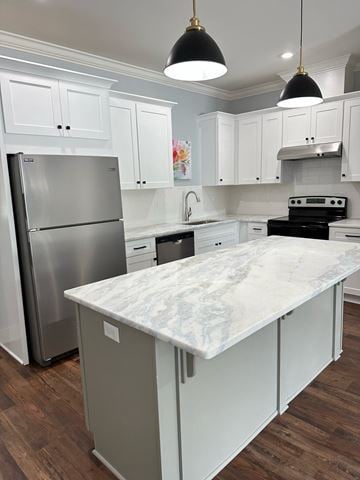 Crowley apartment for rent - a white kitchen with stainless steel appliances and a marble counter top