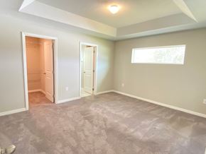 St Cloud house for rent - an empty living room with a door to a closet and a window