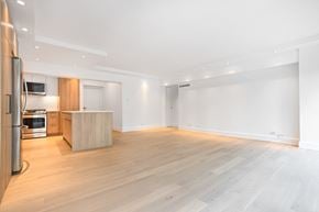 Hampstead apartment for rent - a living room and kitchen with wood floors and white walls