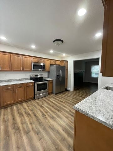 Lima apartment for rent - A kitchen with wooden cabinets and stainless steel appliances.