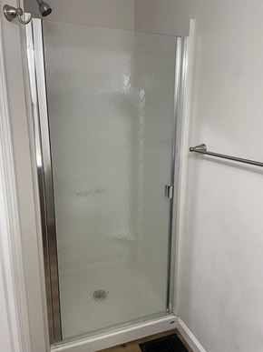 Lima apartment for rent - A glass shower door in a bathroom.