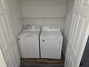 Lima apartment for rent - two washers and dryers in a small room with white walls