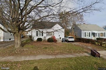 Lima house for rent - a white house with a car parked in front of a tree