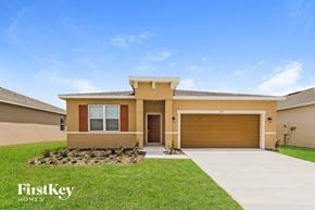 Bartow house for rent - a brand new house with a driveway and a garage door