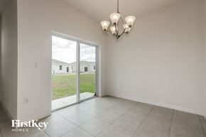 Bartow house for rent - the living room and dining room of a house with a large window
