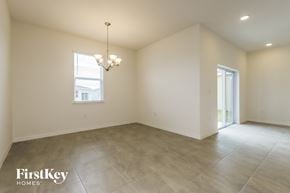 Bartow house for rent - the living room and dining room are spacious and lighted by a chandelier