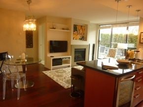 Vancouver apartment for rent - a living room with a kitchen and a dining room