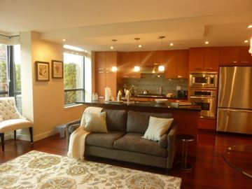 Vancouver apartment for rent - a living room with a couch and a kitchen