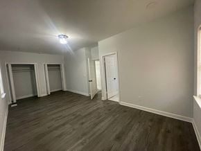 Atlanta house for rent - a living room with gray walls and a wooden floor