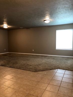 Dell Rapids apartment for rent - a empty room with a tile floor and a window