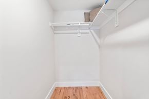 Newark apartment for rent - a room with white walls and a wood floor and a white shelf on the ceiling