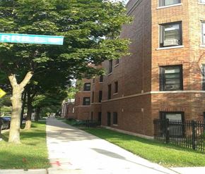 Chicago apartment for rent - a street sign in front of a brick building