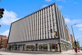 Chicago apartment for rent - a tall building on the corner of a city street