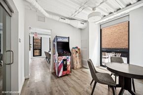 Chicago apartment for rent - a dining room with a table and chairs and a vending machine