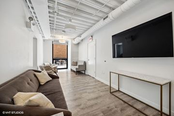 Chicago apartment for rent - a living room with a couch and a tv