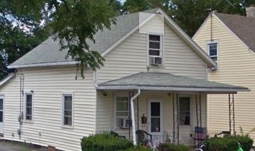 Lima house for rent - a white house with a gray roof and a tree
