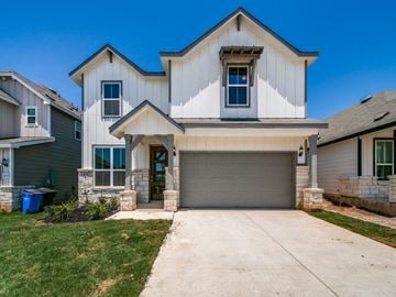 Seguin house for rent - A two-story house with a garage and a driveway.