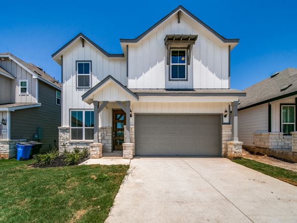 Seguin house for rent - A two-story house with a garage and a driveway.